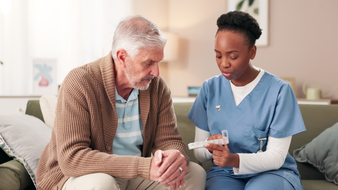 Nurse assisting senior man with medication