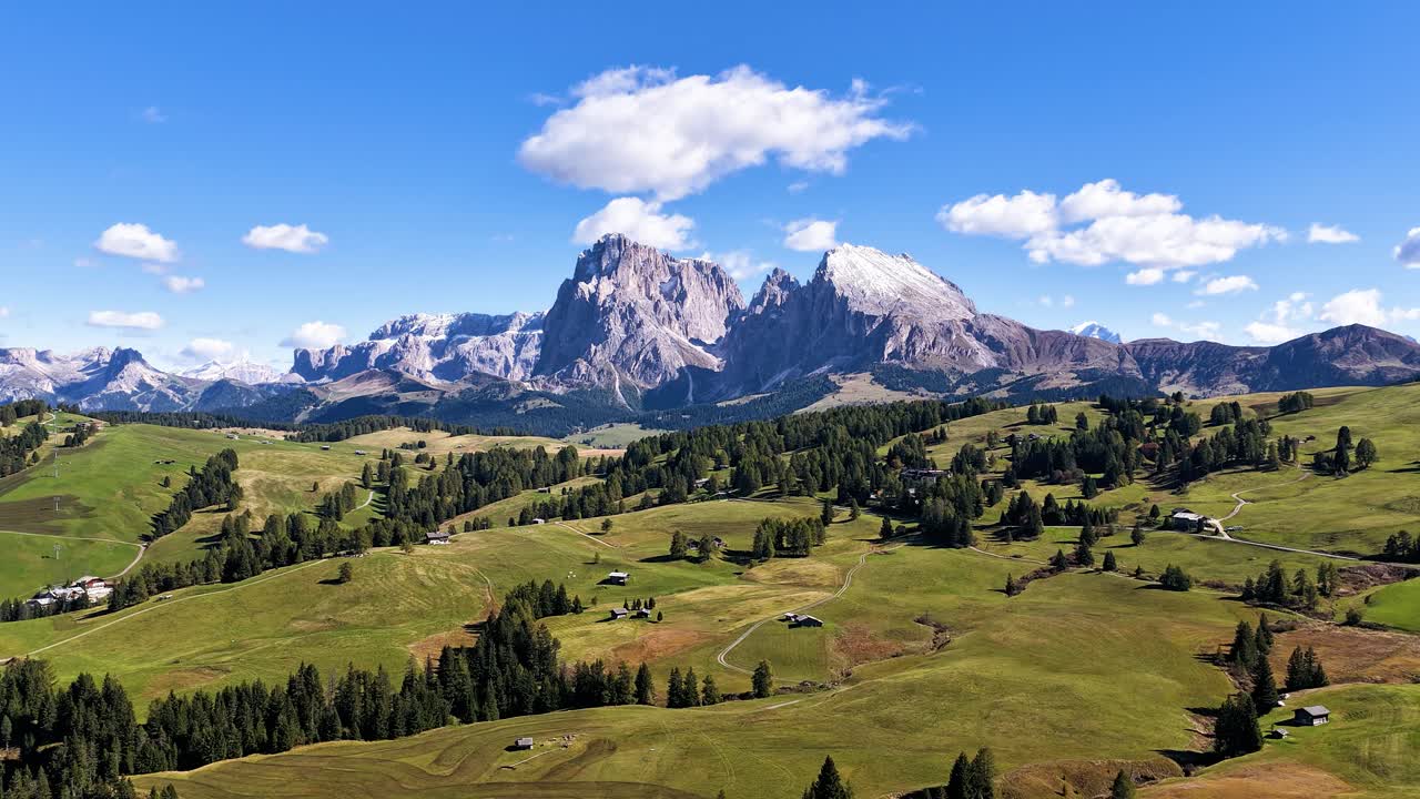 Alpe di Siusi, seiser Alm, dolomites mountain range, alpine pasture, aerial timelaspe. Nature Park, touristic hotspot, summer time view