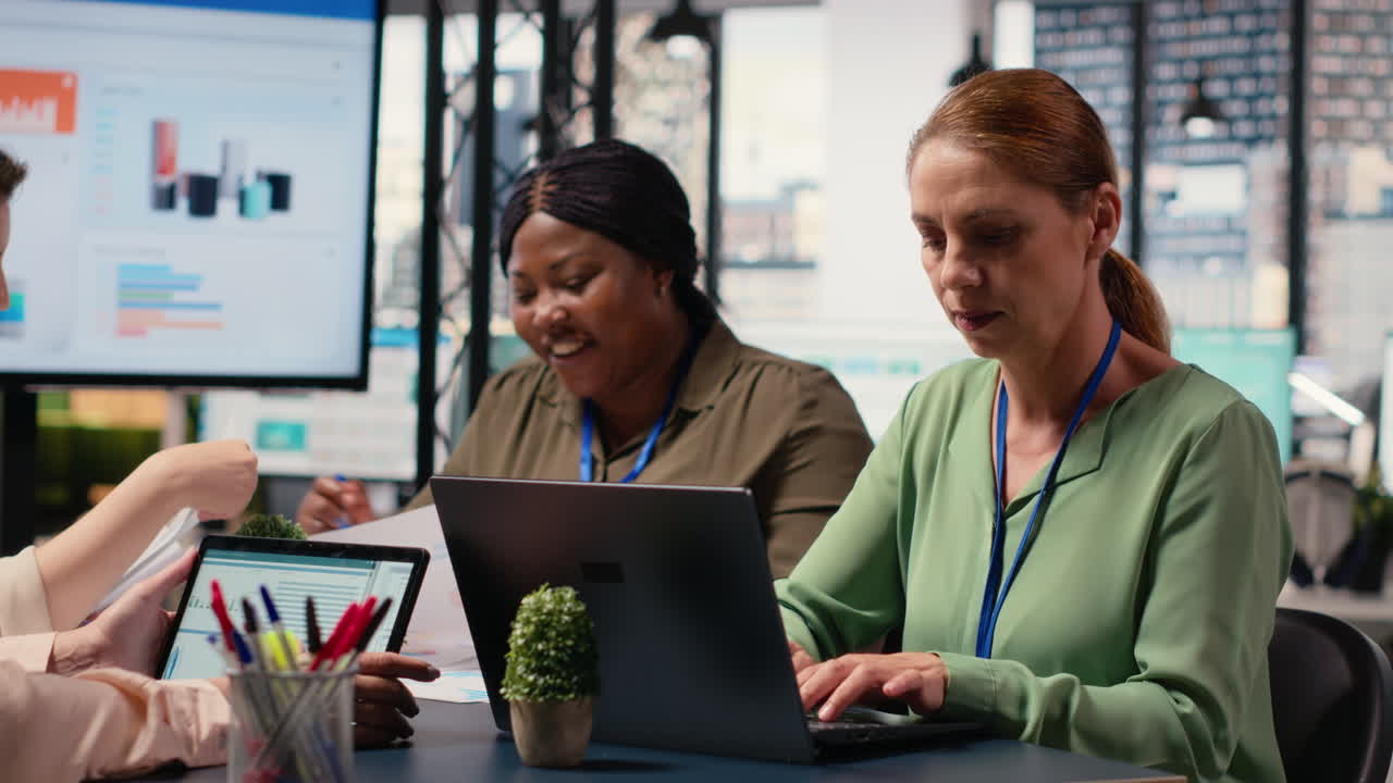 Vertical Video Ambitious focused woman at desk reviewing business strategy