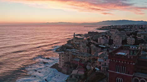 Vivid-sunset-ocean-and-coastline-drone-view-at-Boccadasse-Genova,-Italy