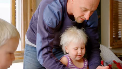 Father-and-children-playing-together-with-clay-in-a-comfortable-home-4k