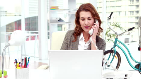 Casual-designer-working-at-her-desk