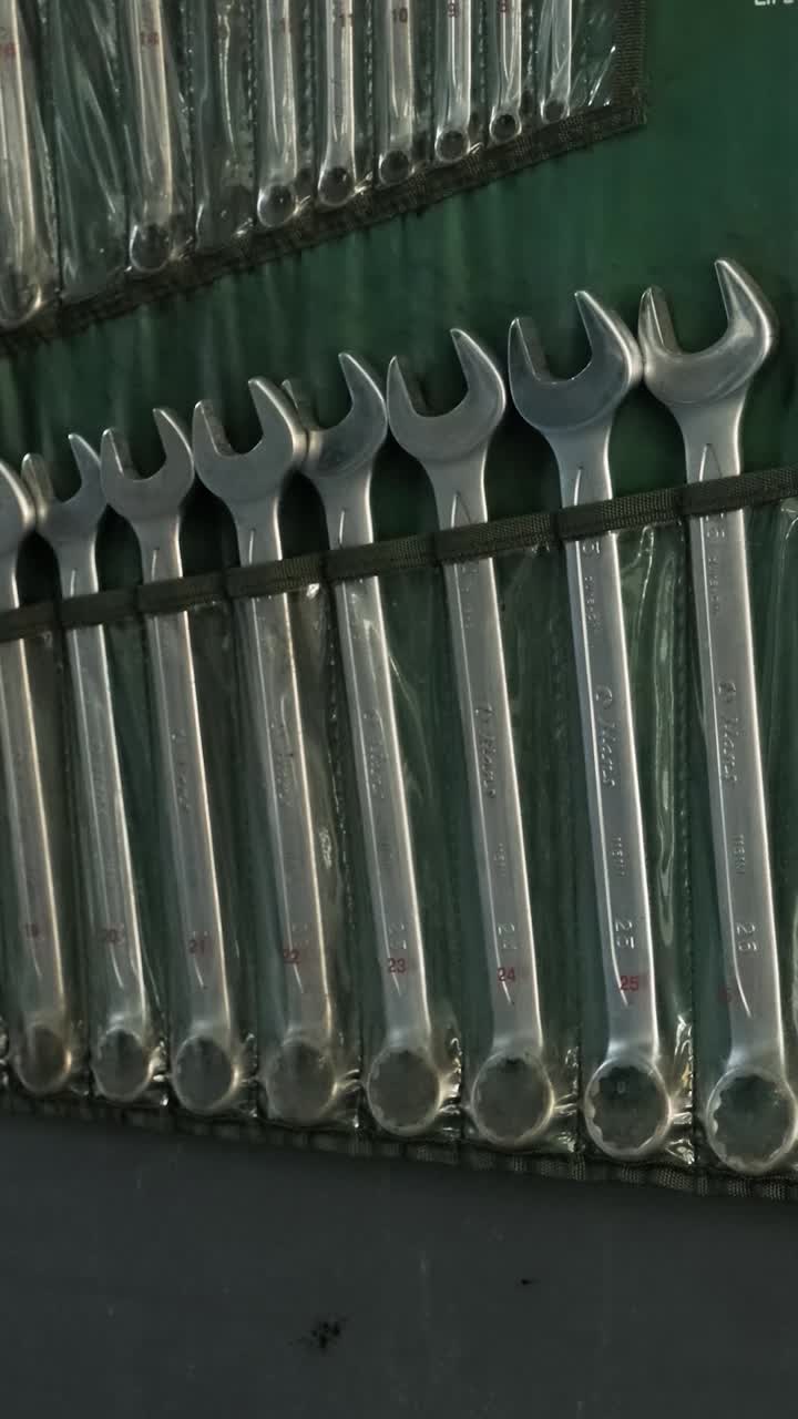 Hand Selecting a Wrench from an Organized Tool Set