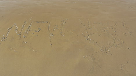 new york with heart drawn on sand