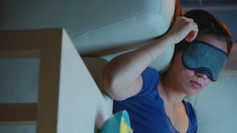 vertical video: woman sleeping with eye covering mask