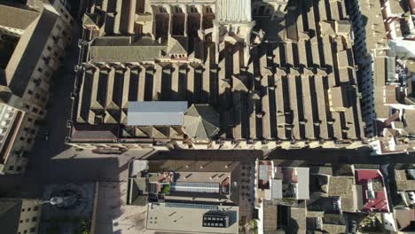 mosque-cathedral of cordoba topdown view slowly tilt up revealing sprawling cityscape. andalusia