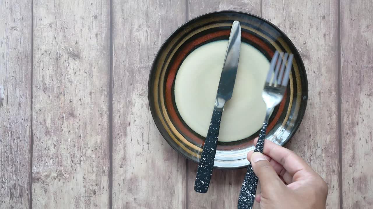Empty Plate and Cutlery on Wooden Table