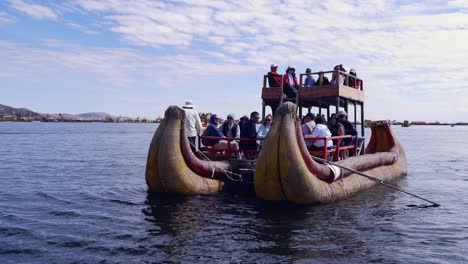 traditional lake titicaca tourism reed boat arrives full of tourists