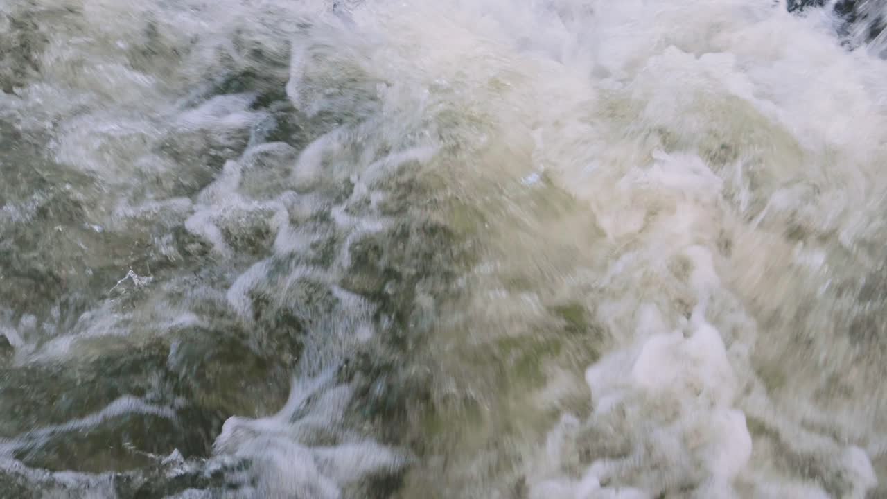 Slow motion shot of rolling streams of water falling from a height