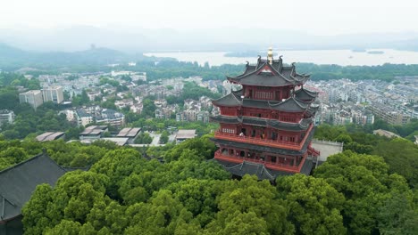 aerial establishing shot of tourists visiting the hangzhou city god temple, china