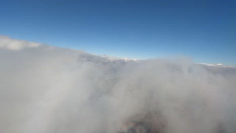 4k plane view of clouds revealing appalachian mountains, va