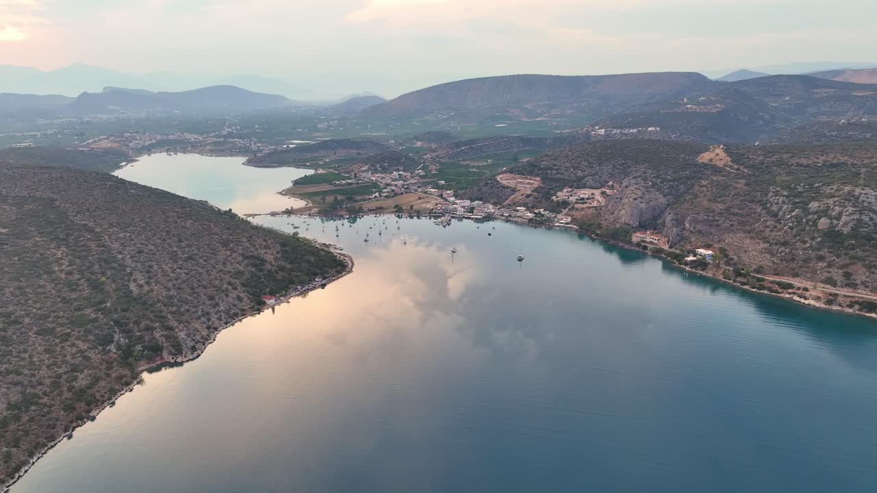 Flying over a calm lake at sunset