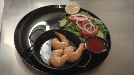 savoring the delight of freshly cooked shrimp with vibrant salad on a sunlit table