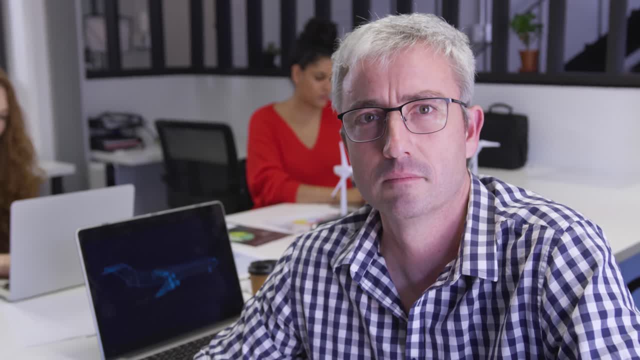 Caucasian man working in creative office