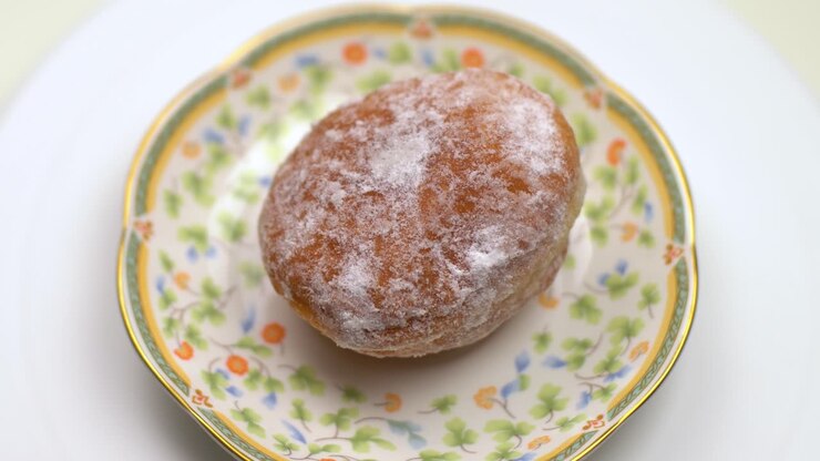 The donut rolls on the plate. White background