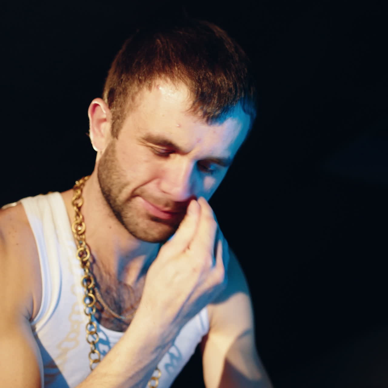 Young man sniffing cocaine on a mirror with a roll of banknotes. Abuse of drugs. Criminal business Square video