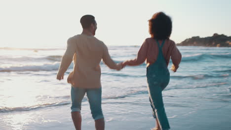 beach, holding hands and couple with sunset