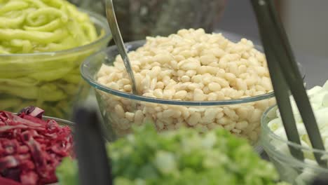 close-up of a salad bar with various fresh ingredients