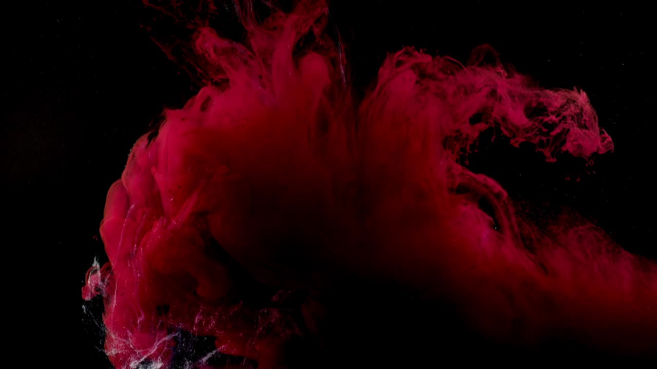 Abstract forms. Shooting on a black background. Mixing of paints