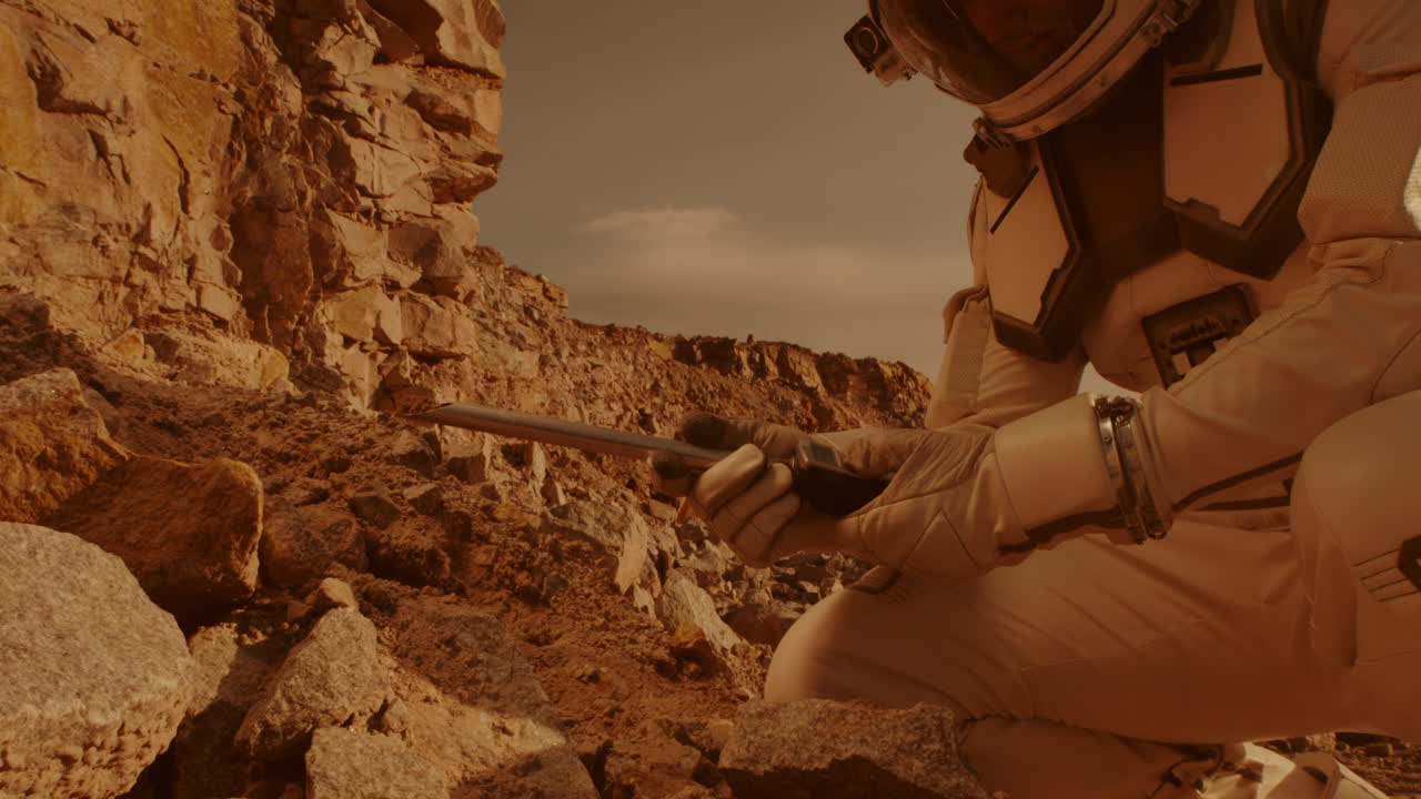 Astronaut on Mars Collecting a Rock Sample