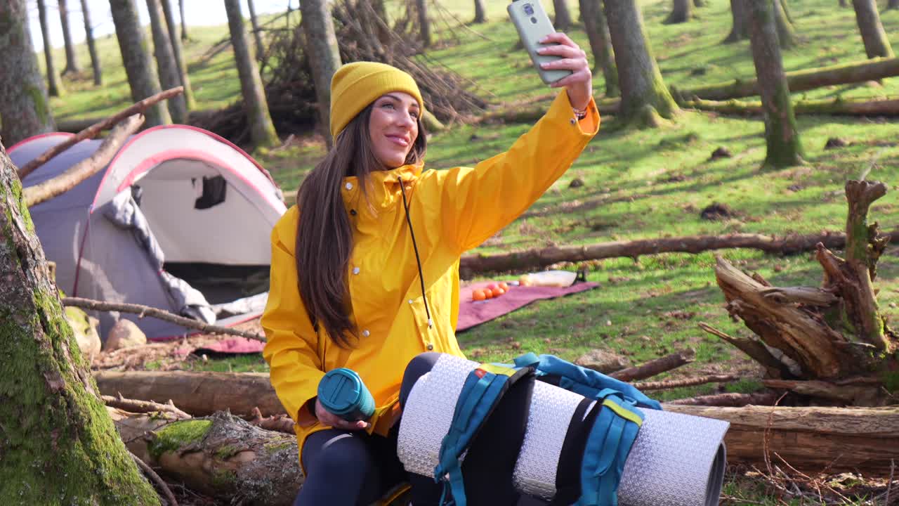 Woman Taking Selfie While Camping in Forest