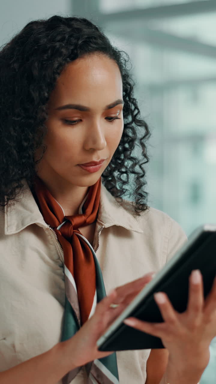 Young Woman Using a Digital Tablet in a Modern Office