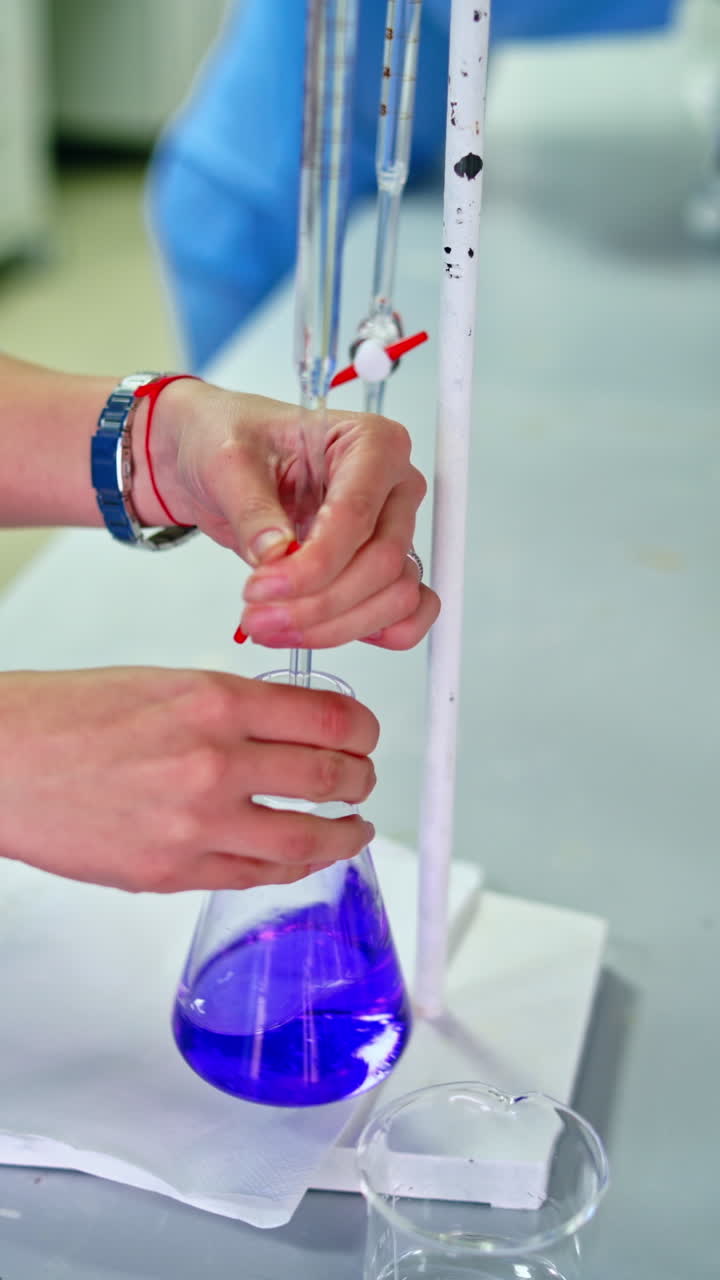 Pharmaceutical factory workers. Technician inspecting the quality of pills at a pharmaceutical plant. Vertical video