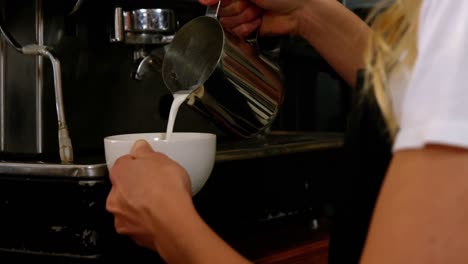 waitress making cup of coffee