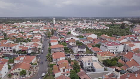 Aerial-drone-flyover-in-Grandola,-a-small-town-in-Portugal,-on-a-cloudy-day