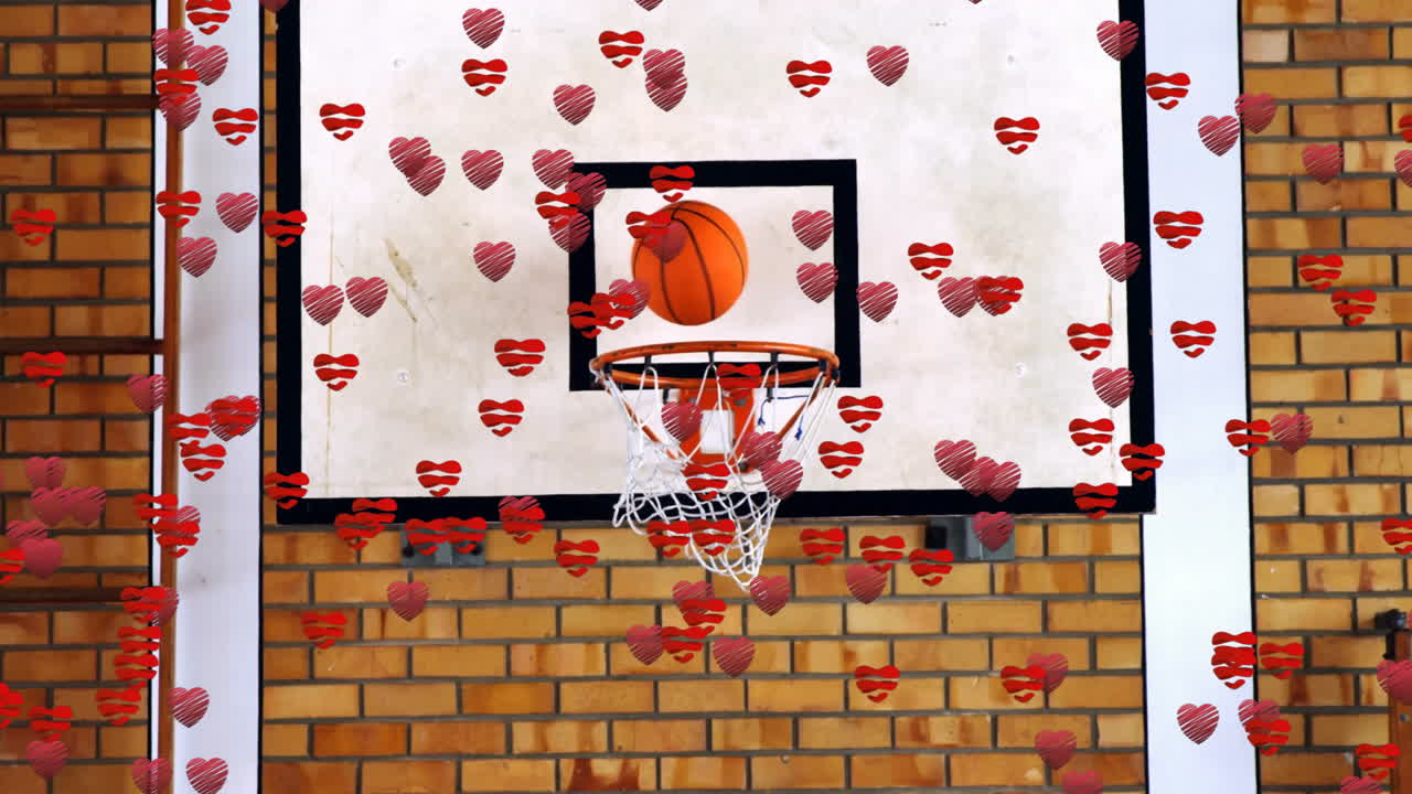 Animation of basketball hoop with ball, surrounded by red heart shapes