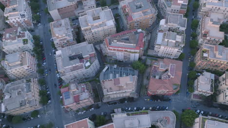 Slow-aerial-pan-up-of-apartment-buildings-outside-of-Rome-in-the-light-of-sunset