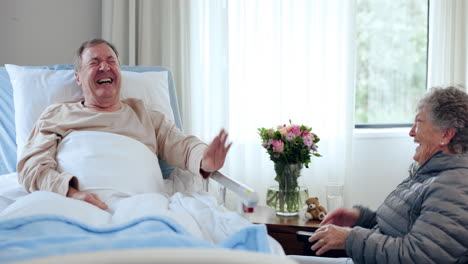 old man in bed laughing, woman