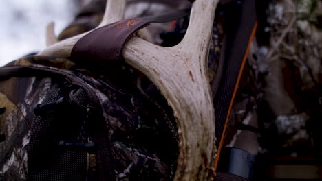 tight shot of hunters backpack with hunting gear