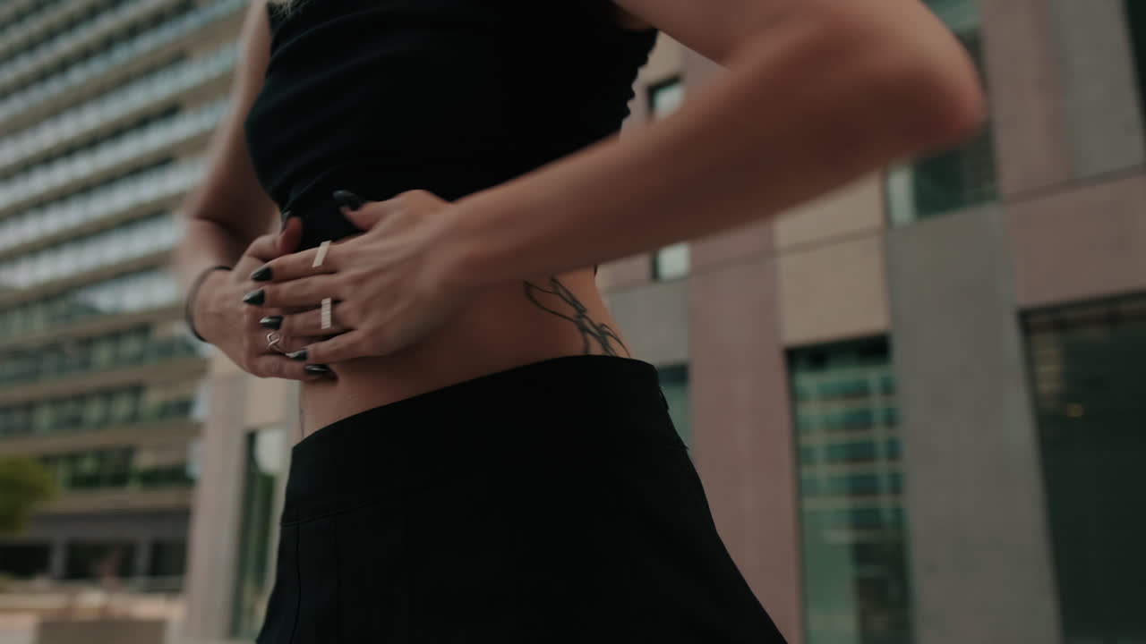 Young Woman Dancing Expressively in Urban Environment