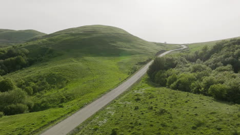 Aerial-dolly-in-shot-of-the-beautiful,-peaceful-and-sunny-Kojori-countryside