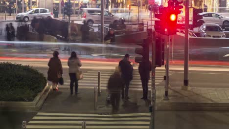 Crosswalk-in-garibaldi-railway-station-with-people,-Milan,-Italy