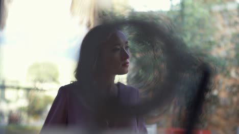 woman in purple dress, blurred background