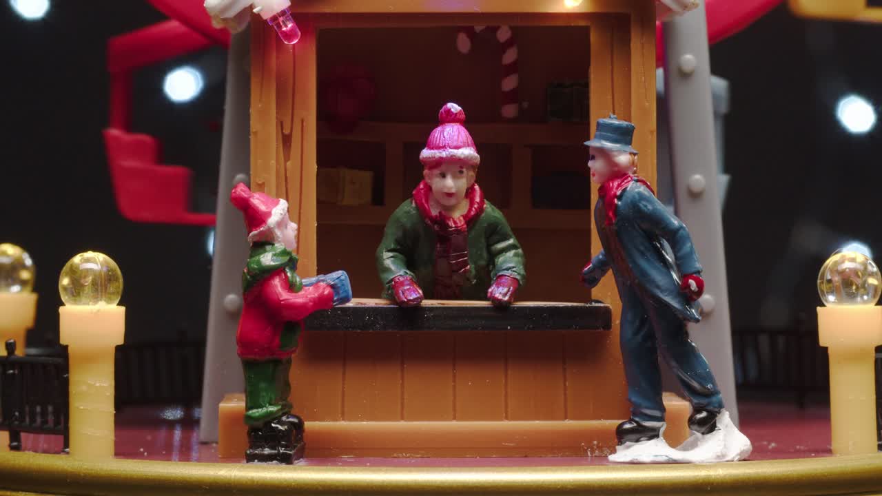 Miniature Christmas Village Scene with Figurines and Ferris Wheel