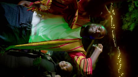 africans dancing at a garden party - vertical shot