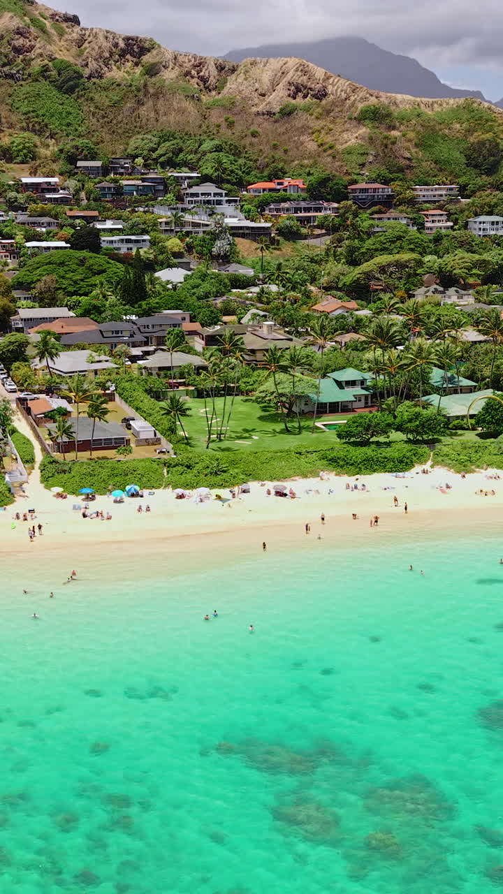 Vertical Drone Shot of Lanikai Beach, Popular Spot on Oahu Island, Hawaii USA, White Sand, Turquoise Ocean and Green Landscape