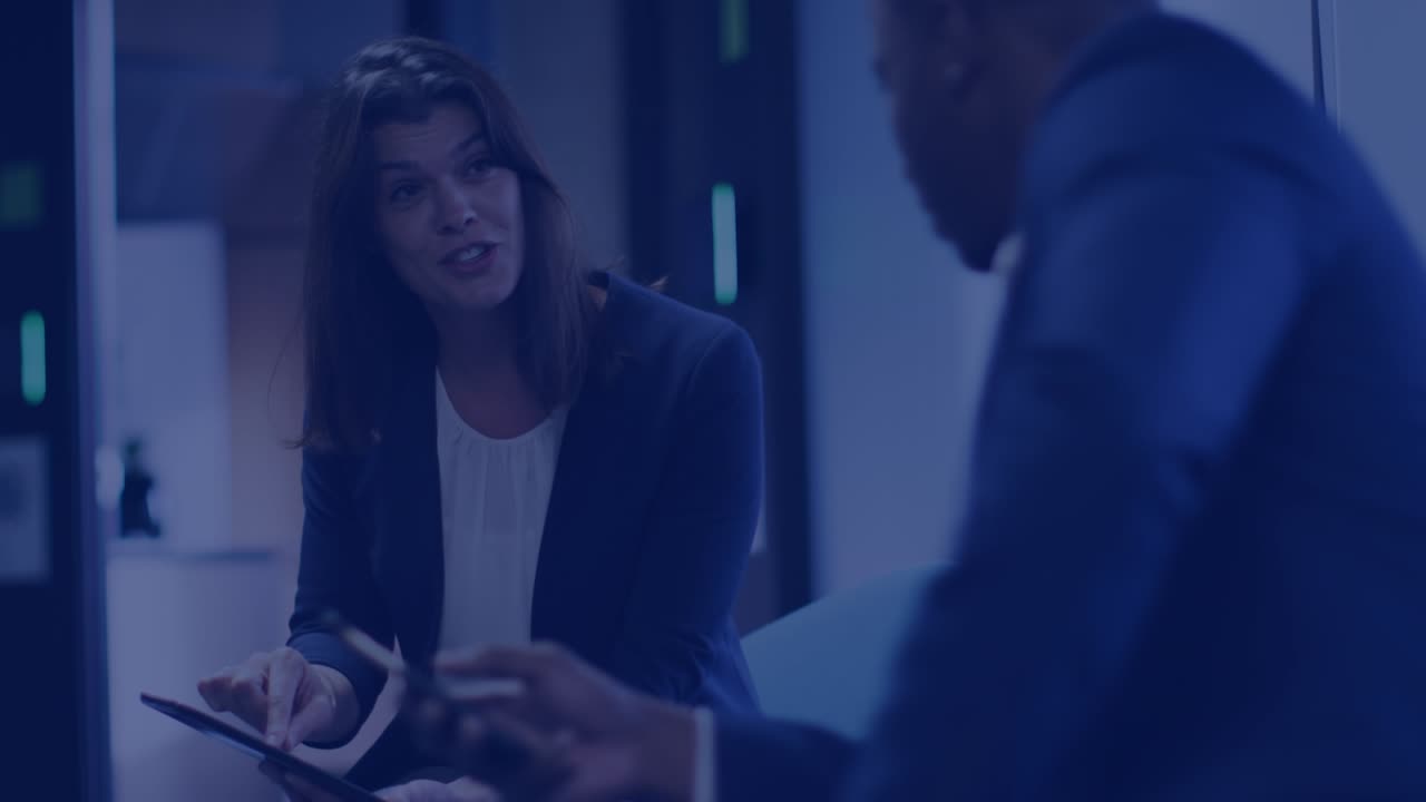 Animation of media icons over diverse business people talking