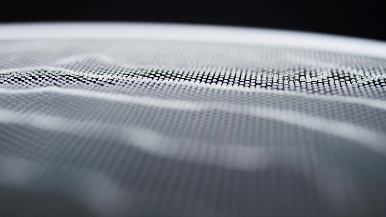 Closeup Mesh Fabric Rippling Across Monochrome Surface, Fine Grid Texture With Soft Focus Foreground, Subtle