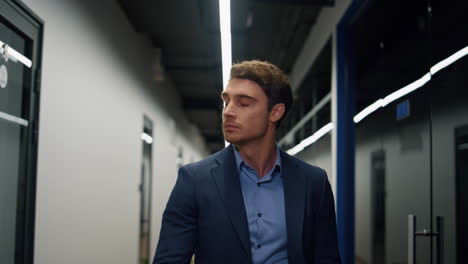 office employee walking hallway closeup. confident executive go client meeting