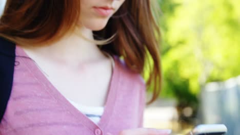 Schoolgirl-using-mobile-phone