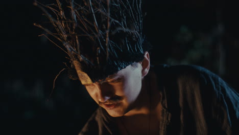 mystic figure with branch crown in night ritual