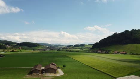 wide angle aerial view beautiful green farm and fields in switzerland