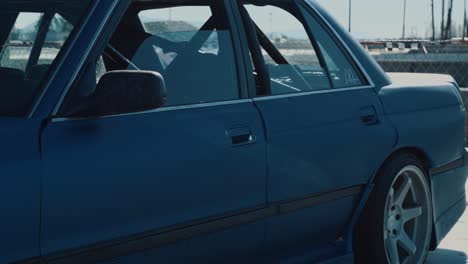 slow motion shot of a vintage toyota modified for drifting races