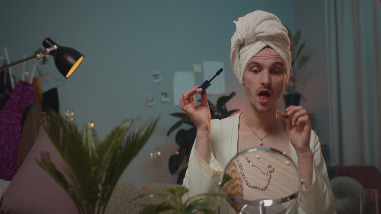 Person applying makeup in mirror