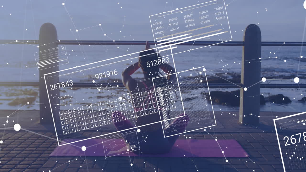 Practicing yoga by sea, woman with digital data overlay animation