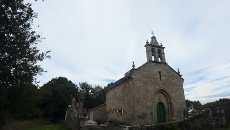 ancient stone church in a rural cemetery